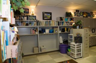 Here is the backside of the two cabinets (This photo was taken after school, so the mess is gone). The two white stacking containers contain math manipulatives.  The purple tub houses student lunches.